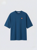 Marine Blue_oversized_boxy_tee_with_1.5_inch_embroidered_tiger_face_icon_logo_by_studio_tigre_on_a_premium_uniqlo_airism_tee on a white background